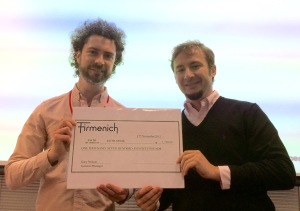 Global Category Manager Carlos Almasque presents Fifth Sense founder Duncan Boak with the money raised by the Firmenich team